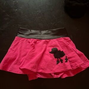 Hot pink poodle skirt bummies with faux leather trim at the waist